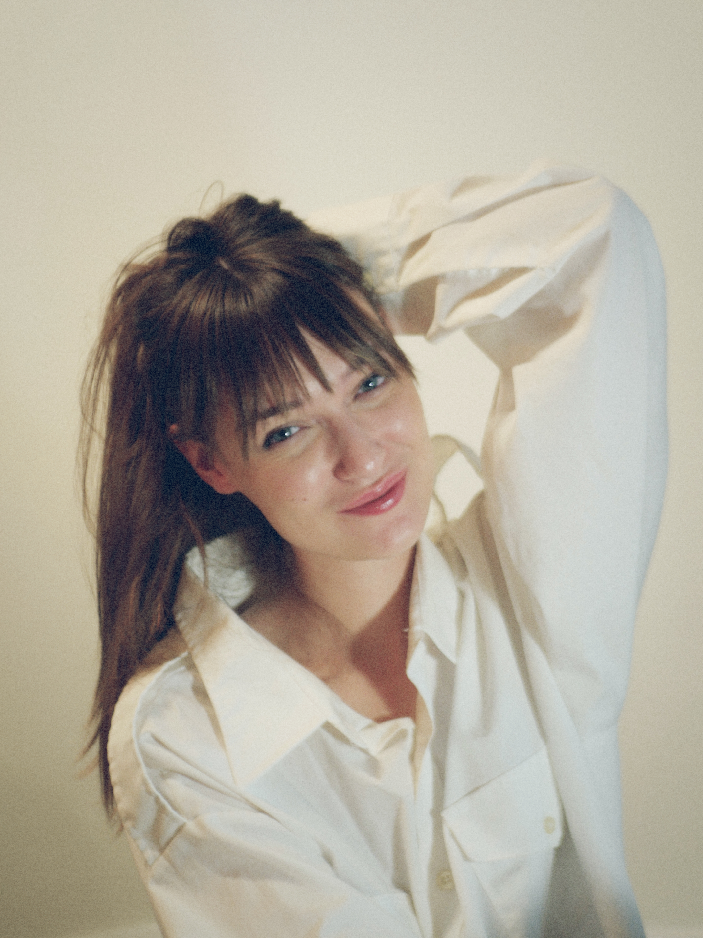 Christine Brouillette, Brand Strategist, Orlé, smiling with one hand behind her head